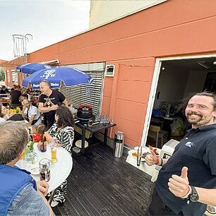 A summer party gathering on the building's rooftop